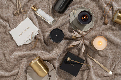 btncl candles, perfume and candle accessories on warm neutral velvet