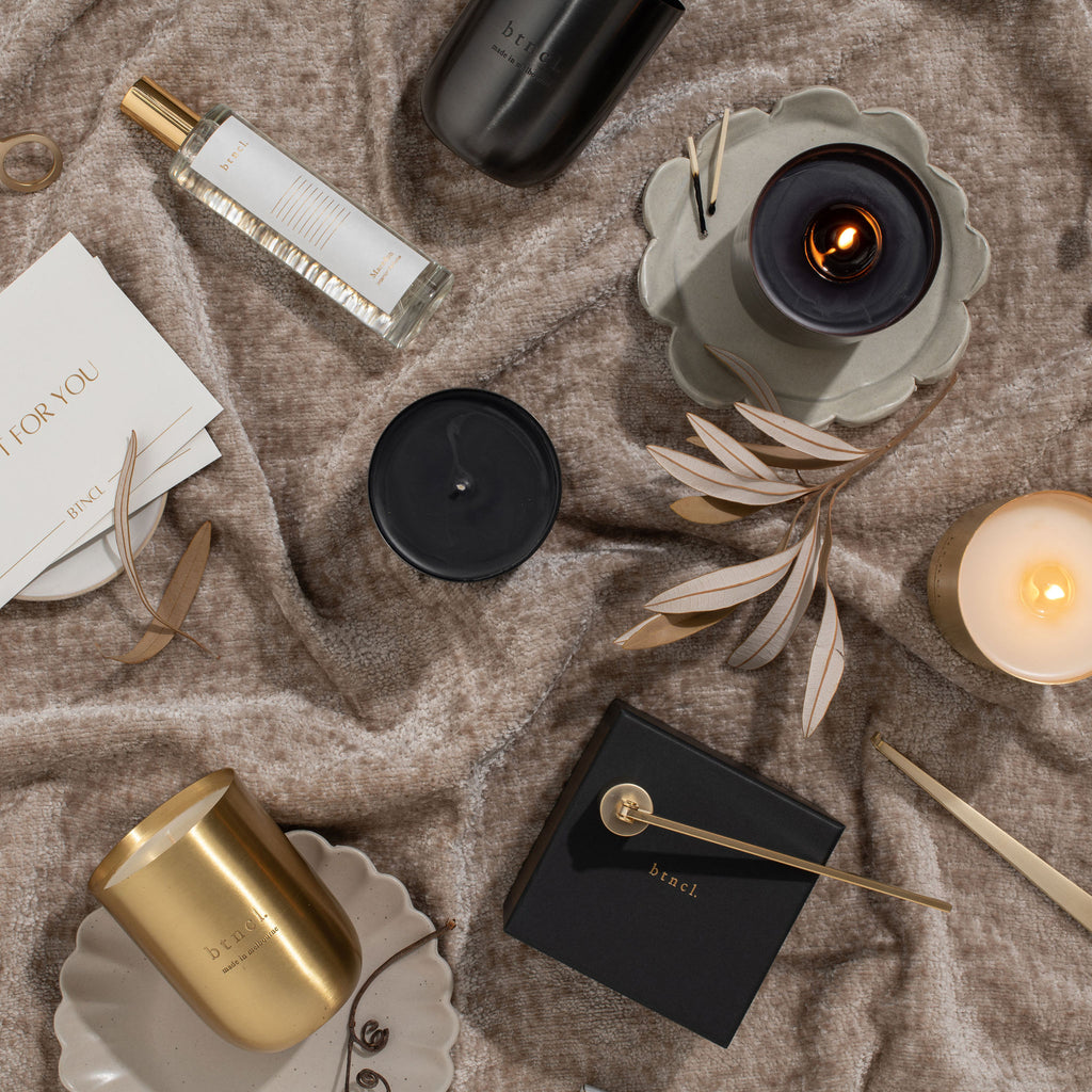 btncl candles, perfume and candle accessories on warm neutral velvet