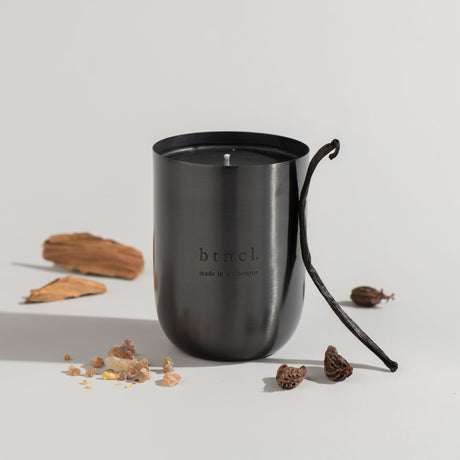 black santal candle with vanilla bean and wood
