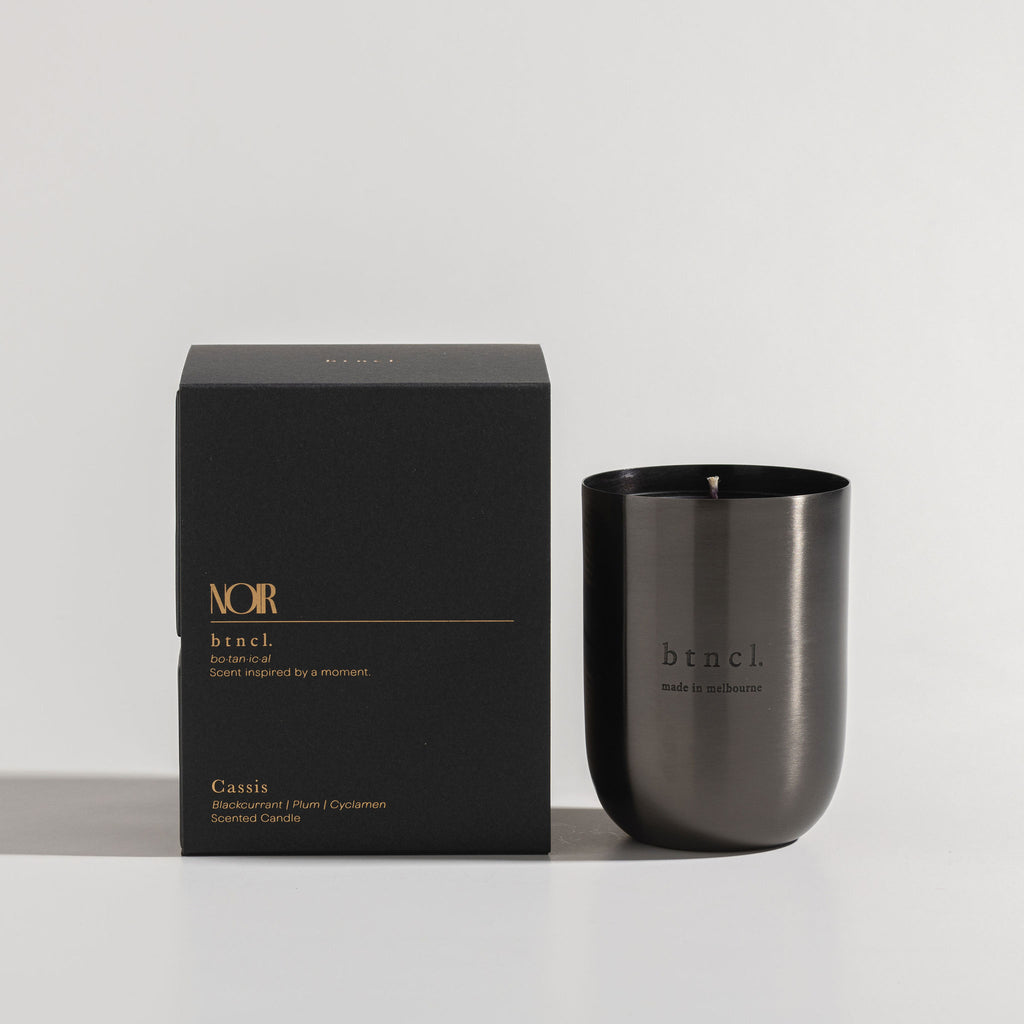 Black Candle next to packaging