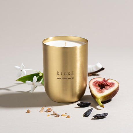 Brass candle with fresh fig and coconut